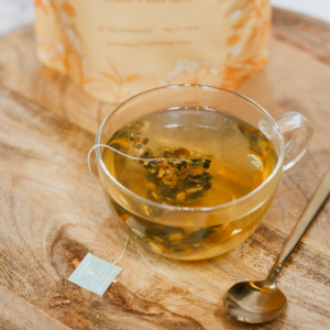 The Tonic Ginger Turmeric Teabag in a glass cup